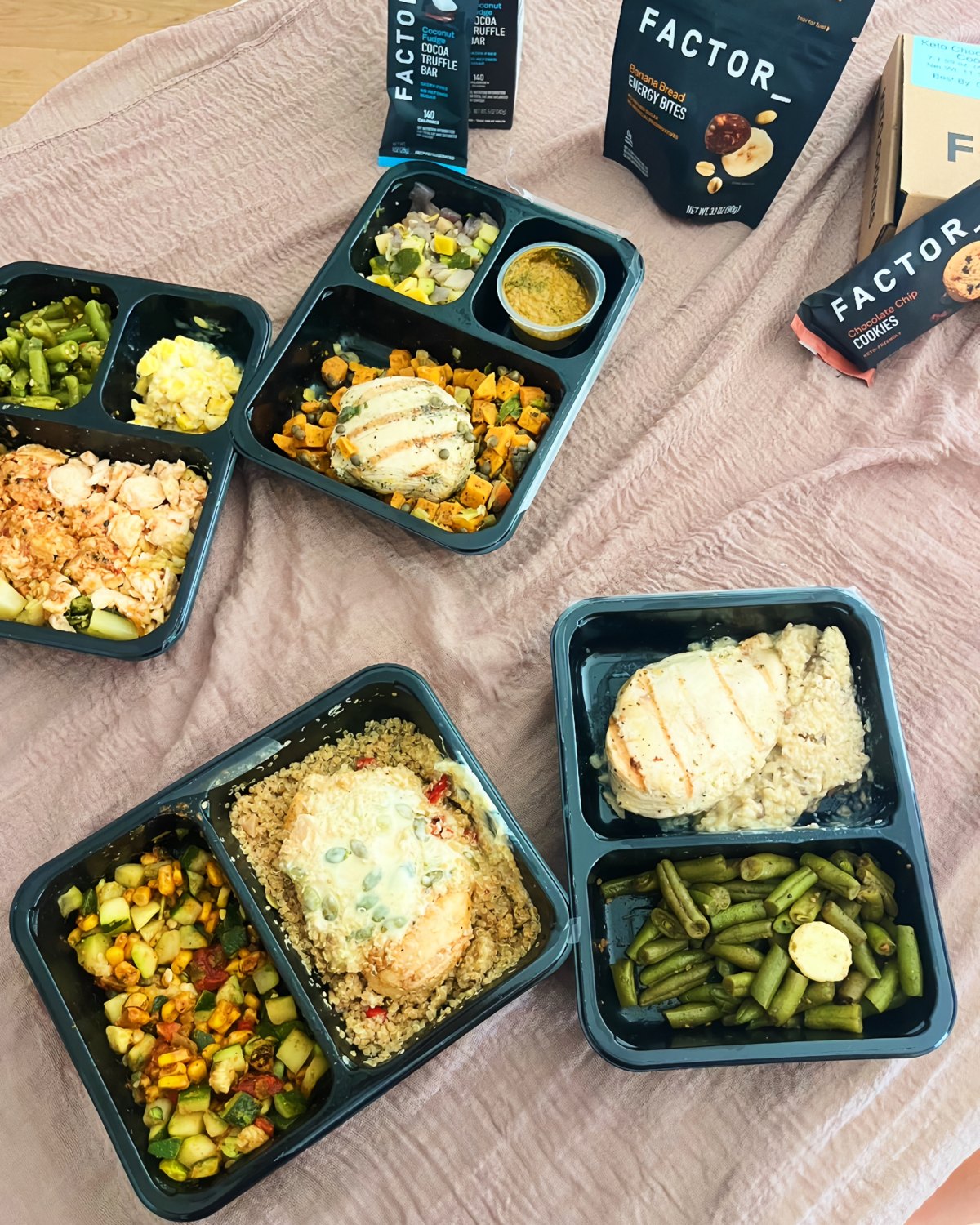 A flat lay of Factor prepared meals in their trays