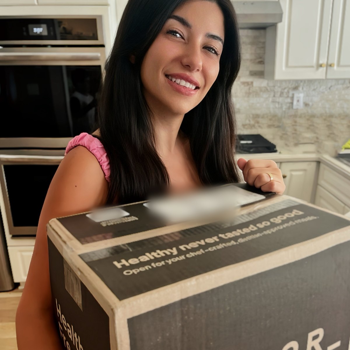 Kristel with the Factor box at her door